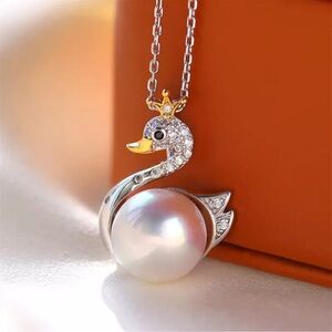 Genuine 9-10mm South sea pearls swan silver plated necklace.